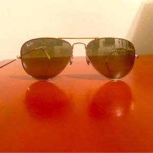 Gold rayban sunglasses with white handle